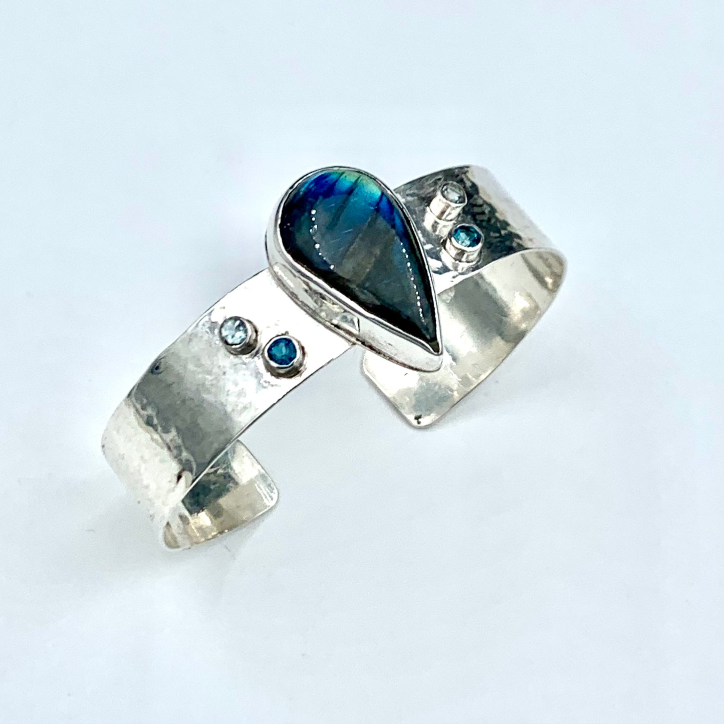 Artisan created sterling silver cuff bracelet with blue flash labradorite and topaz gemstones
