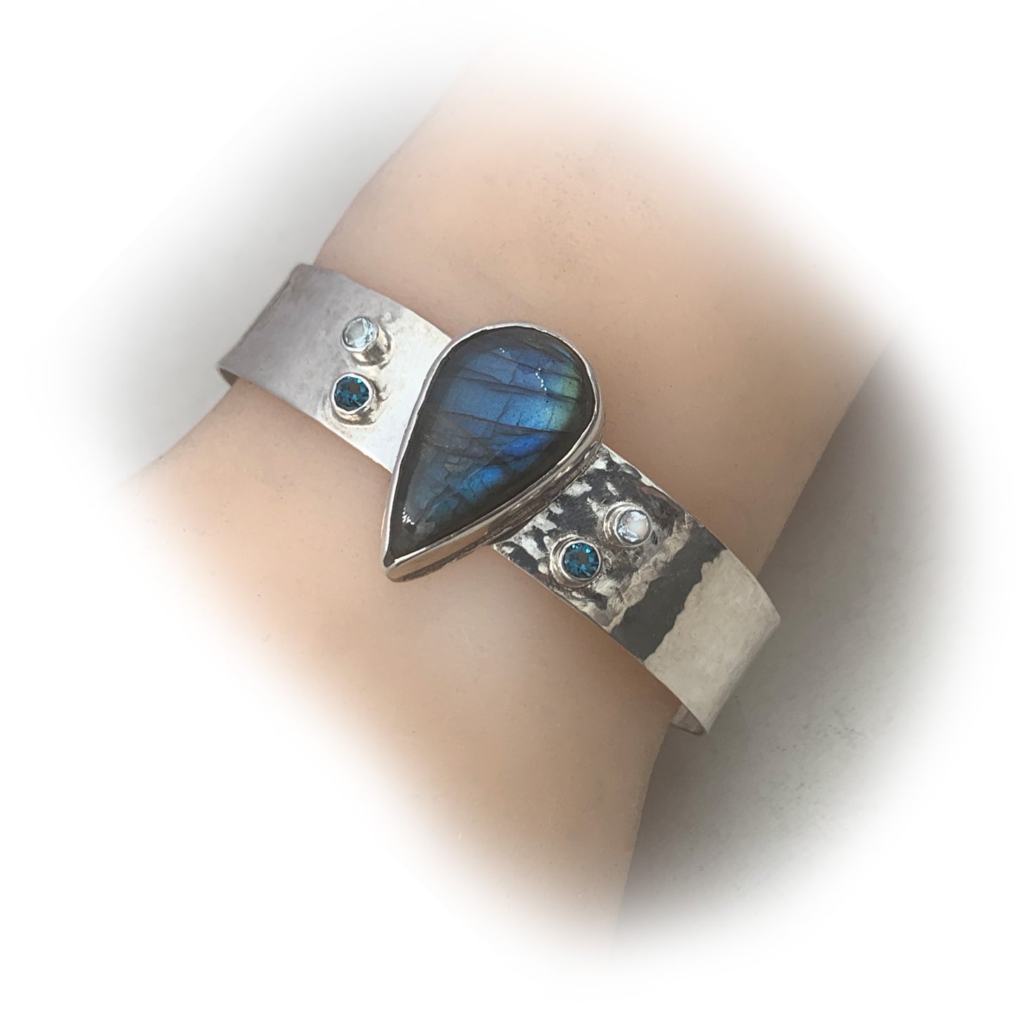 Artisan created sterling silver cuff bracelet with blue flash labradorite and topaz gemstones