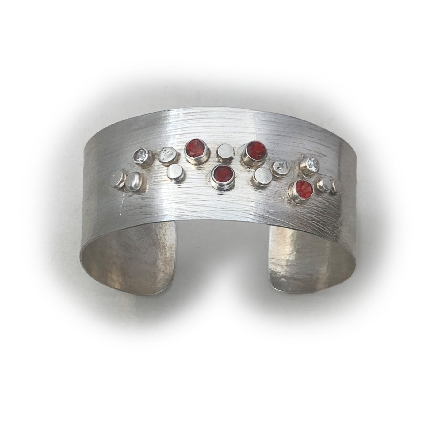 Sterling Silver Galaxy Pattern Cuff with Garnets and Pale Blue Topaz