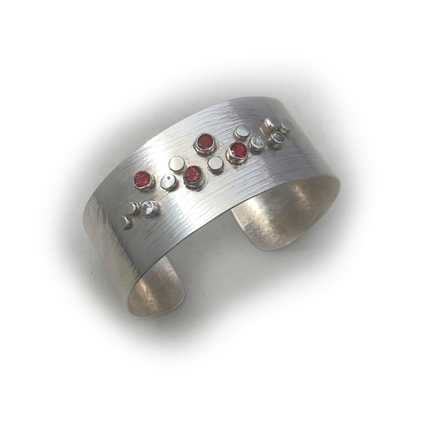 Sterling Silver Galaxy Pattern Cuff with Garnets and Pale Blue Topaz