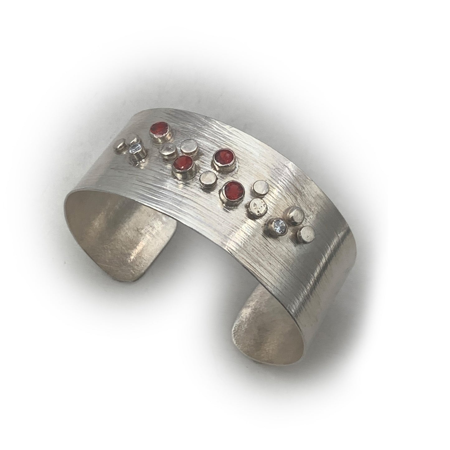 Sterling Silver Galaxy Pattern Cuff with Garnets and Pale Blue Topaz